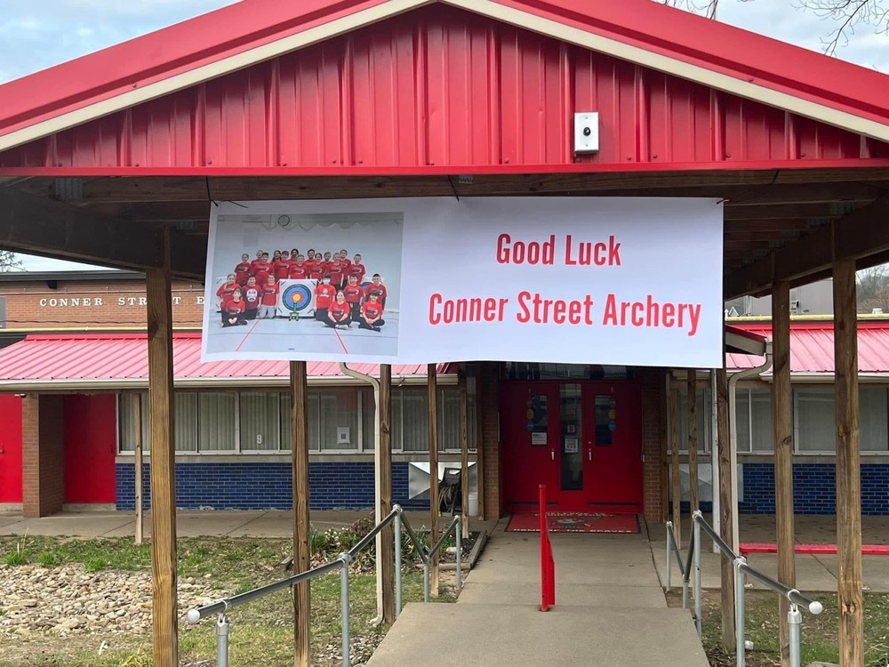 CSE Archery Team Banner outside the front of the school