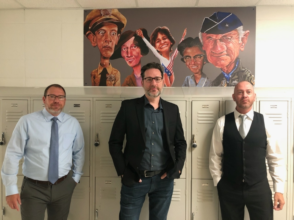 Art mural. Pictured left to right are Denny Paugh (Vice Principal), Jeff Pierson (Artist), and John Arthur (Community Project Coordinator)