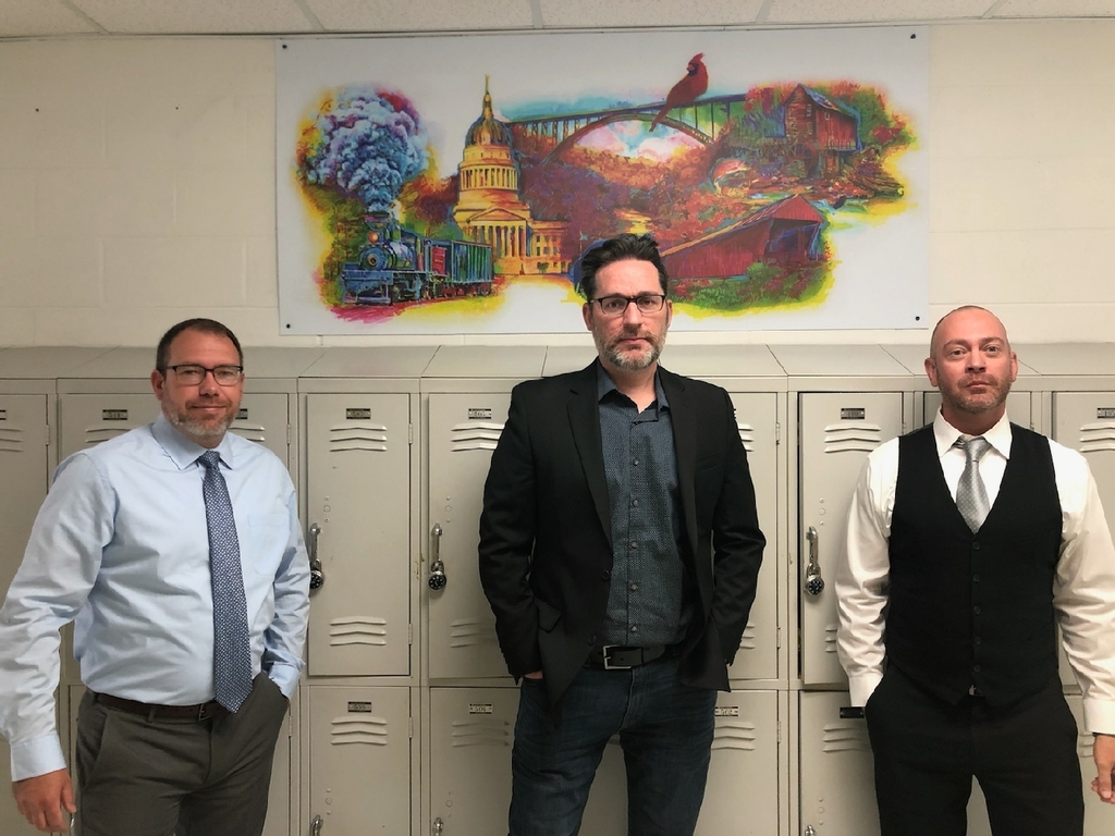 Art mural. Pictured left to right are Denny Paugh (Vice Principal), Jeff Pierson (Artist), and John Arthur (Community Project Coordinator)